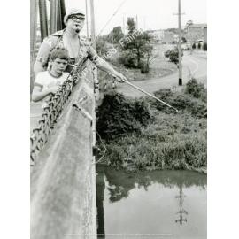 Fishing off Carramar Railway Bridge, Carramar, NSW