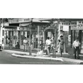 Pedestrians walking along John Street in Cabramatta