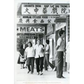 Pedestrians walking past Cabramatta Cinema 