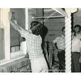 Broken window at the Mittiga Family home