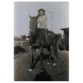 Corinne McBurney riding a horse, Bundanoon NSW, 1946