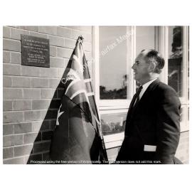 The Hon N.J Mannix unveils a plaque at the official opening of Lansvale Public school, Canley Vale, NSW.