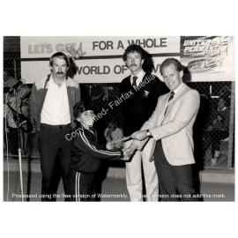 Vince Mellino being presented with his prize in the Berala- Carramar open junior tennis tournament, Fairfield, NSW.