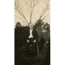 Ted Wakeley seated in the garden