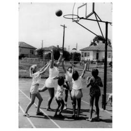Children enjoying a game of Basketball at the first National fitness Children's Holiday play centre, Smithfield NSW, 1962