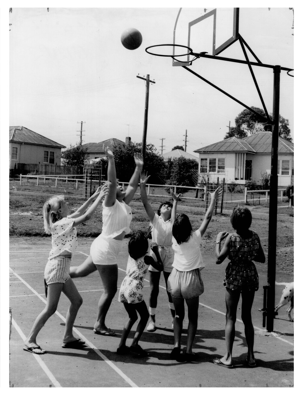 Children enjoying a game of Basketball at the first National fitness Children's Holiday play centre, Smithfield NSW, 1962