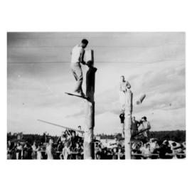 Two men in a wood chopping competition