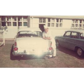 Michael Buczynski leaning on a Holden car, Cabramatta Migrant Hostel, Cabramatta NSW, c. late 1960s