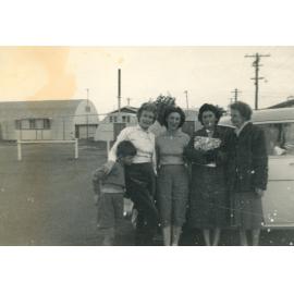Four women and a child standing near a car, Cabramatta Migrant Hostel, Cabramatta NSW