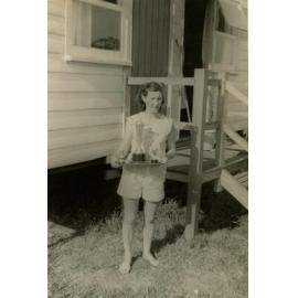 Peggy Pearson posing with David’s trophies, late 1960’s, Cabramatta Migrant Hostel, Cabramatta, NSW.