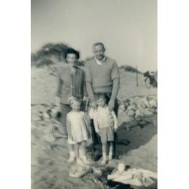 A family standing outside.