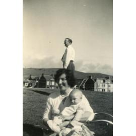 Peggy Pearson holding a baby.