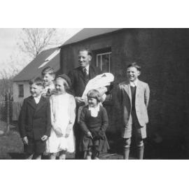 McNeice family standing outside a building